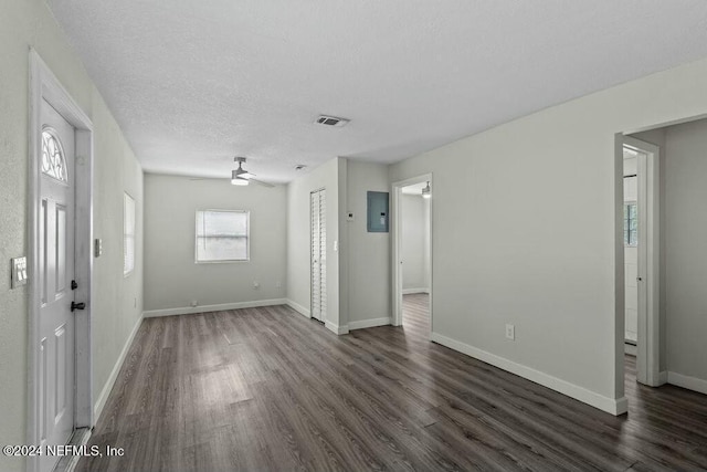 foyer entrance with ceiling fan, dark hardwood / wood-style flooring, and a textured ceiling