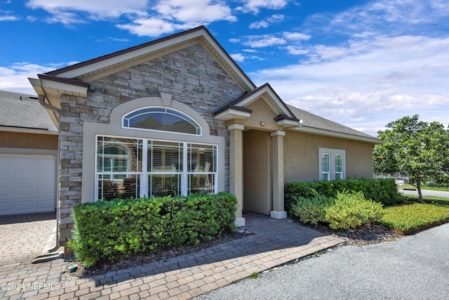 view of exterior entry featuring a garage