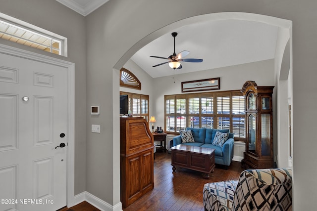 entrance foyer featuring ceiling fan, dark hardwood / wood-style flooring, crown molding, and vaulted ceiling