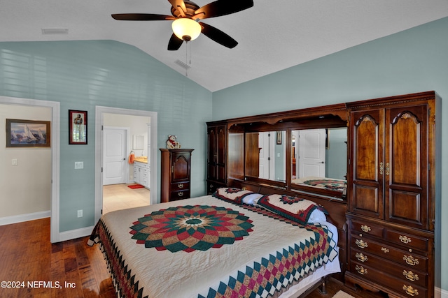 bedroom with ensuite bath, ceiling fan, hardwood / wood-style floors, and lofted ceiling