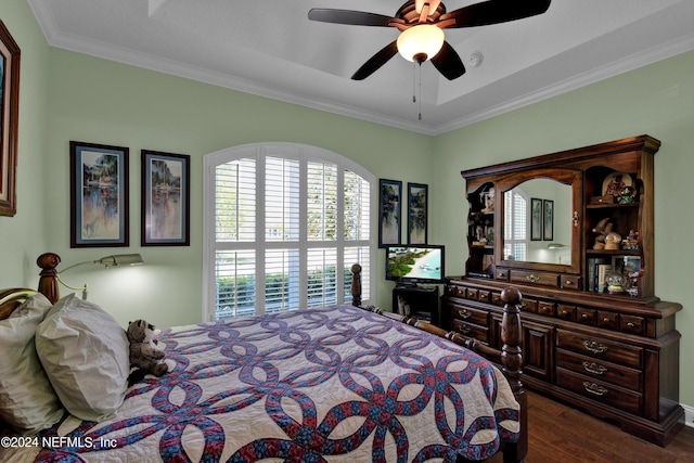 bedroom with dark hardwood / wood-style floors, ceiling fan, and crown molding