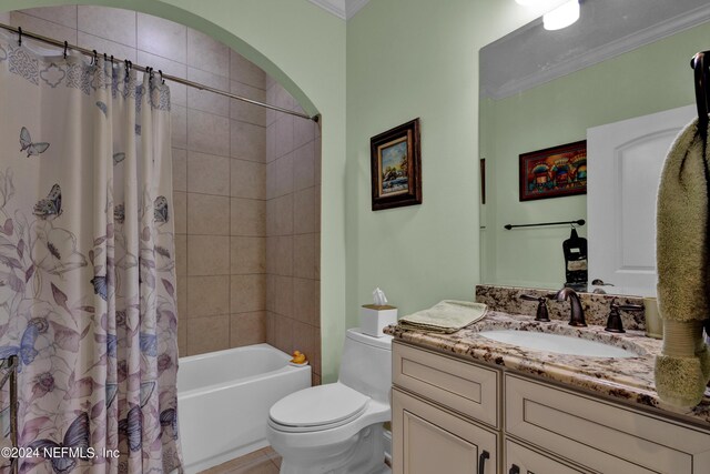 full bathroom with vanity, toilet, ornamental molding, and shower / tub combo