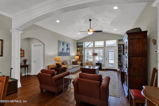 living room featuring ornate columns, ceiling fan, dark hardwood / wood-style flooring, vaulted ceiling, and ornamental molding