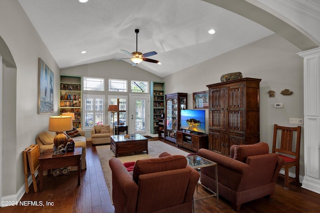 living room with dark hardwood / wood-style floors, ceiling fan, lofted ceiling, and a textured ceiling