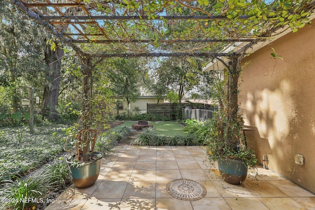 view of patio / terrace featuring a fire pit and a pergola