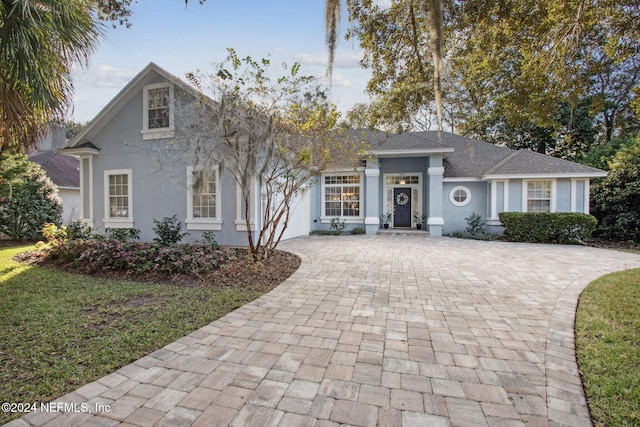 view of front of property with a front lawn