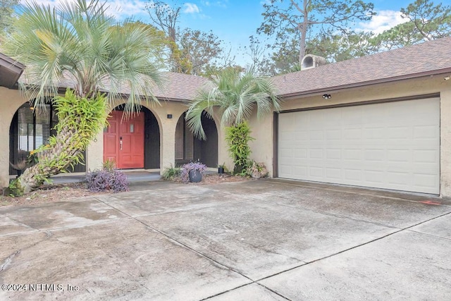 view of front of home with a garage