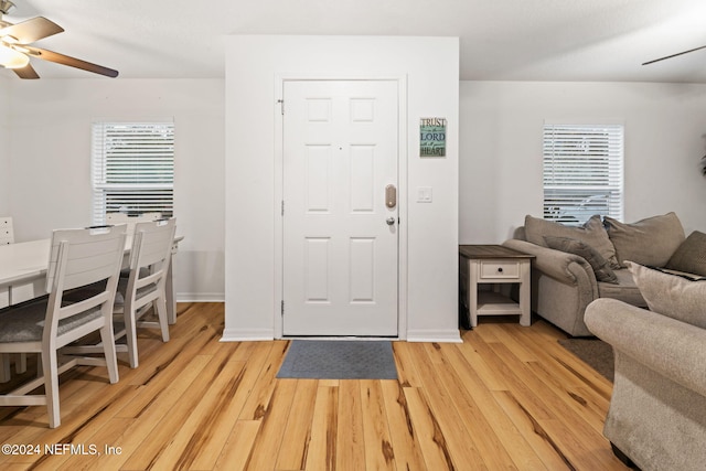 foyer featuring ceiling fan and light hardwood / wood-style flooring