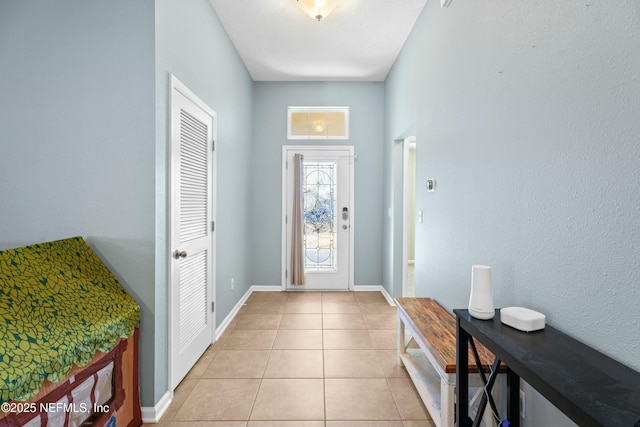 entrance foyer featuring light tile patterned floors