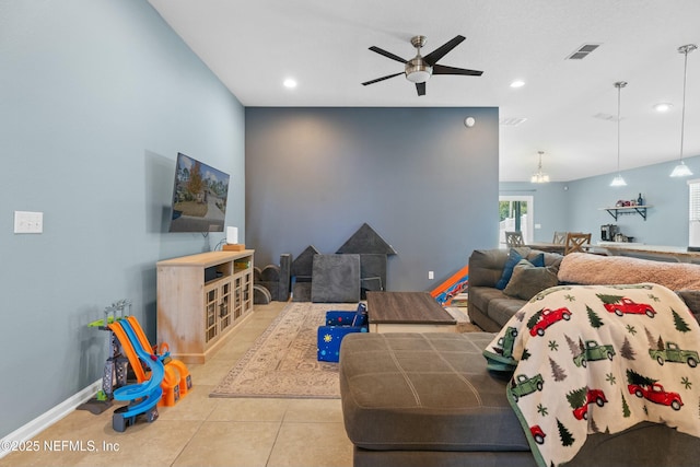 living room featuring ceiling fan and tile patterned flooring