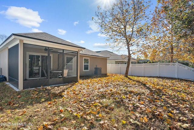 back of house with cooling unit, ceiling fan, and a sunroom