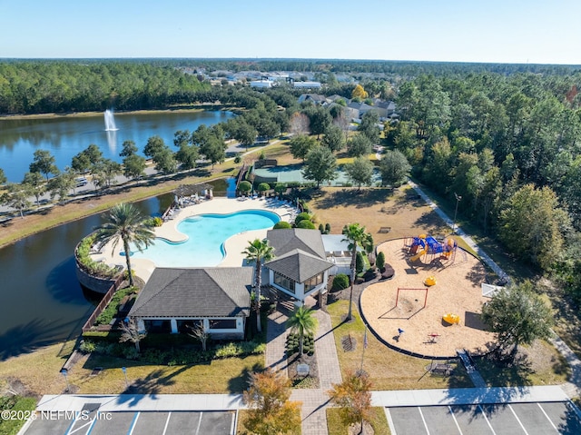 birds eye view of property with a water view