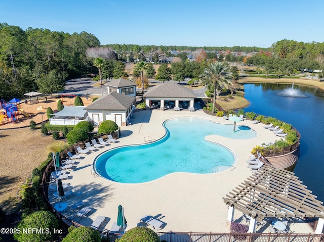 view of pool featuring a pergola, a patio area, and a water view