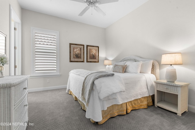 bedroom with carpet flooring, ceiling fan, and vaulted ceiling