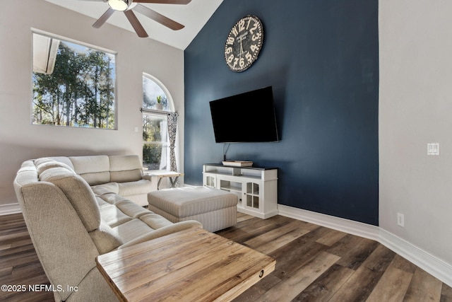 living room featuring ceiling fan, dark hardwood / wood-style flooring, and lofted ceiling