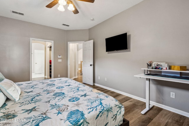 bedroom with ceiling fan and dark hardwood / wood-style flooring