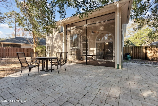 view of patio / terrace with a sunroom