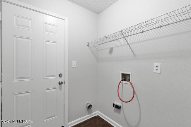 laundry room featuring washer hookup, a textured ceiling, and hookup for an electric dryer