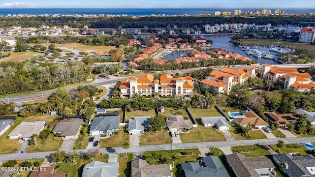 birds eye view of property with a water view