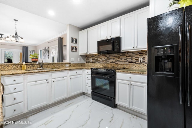 kitchen featuring sink, white cabinetry, and black appliances