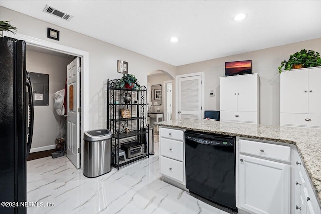 kitchen featuring black appliances, white cabinets, and light stone counters