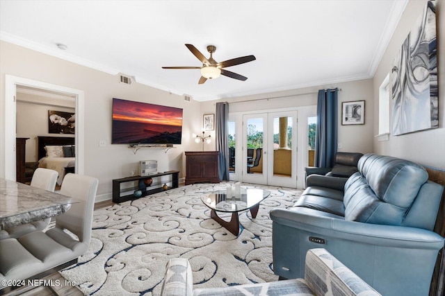 living room with french doors, light hardwood / wood-style flooring, ceiling fan, and ornamental molding