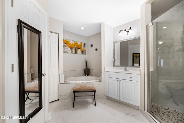 bathroom featuring vanity and shower with separate bathtub