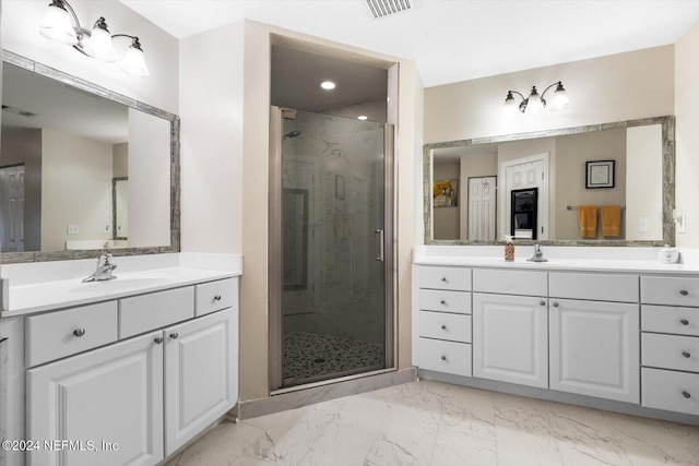 bathroom featuring vanity and a shower with shower door