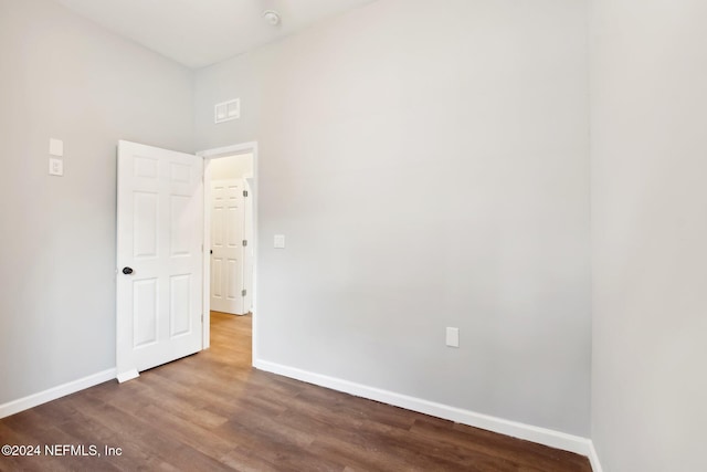 spare room with hardwood / wood-style floors