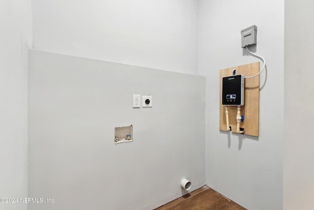 clothes washing area featuring hookup for a washing machine and hookup for an electric dryer