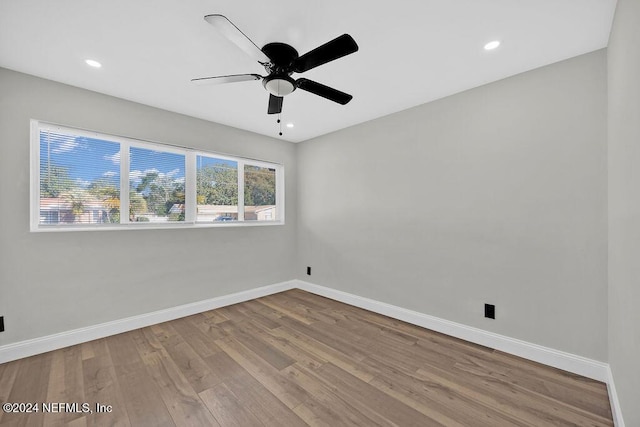 empty room featuring ceiling fan and light hardwood / wood-style floors