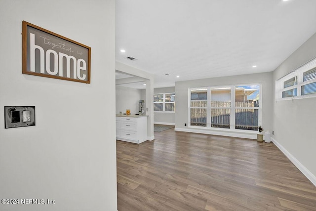 unfurnished living room featuring hardwood / wood-style flooring