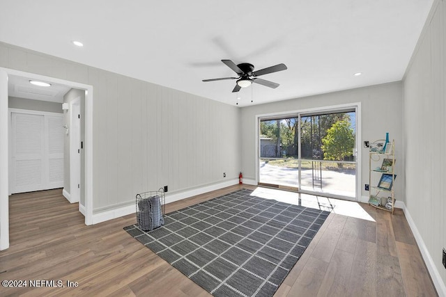 spare room with hardwood / wood-style floors and ceiling fan