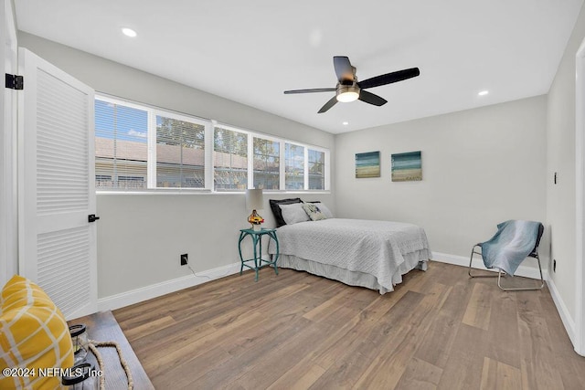 bedroom featuring ceiling fan and light hardwood / wood-style flooring