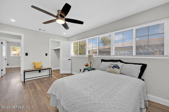 bedroom featuring hardwood / wood-style floors and ceiling fan