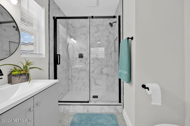 bathroom with vanity and walk in shower