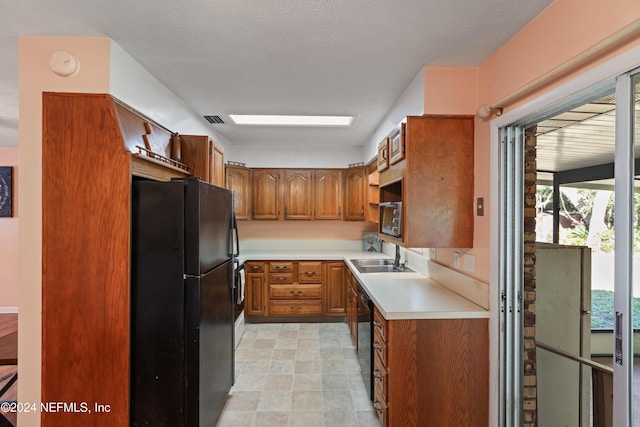 kitchen with black appliances and sink