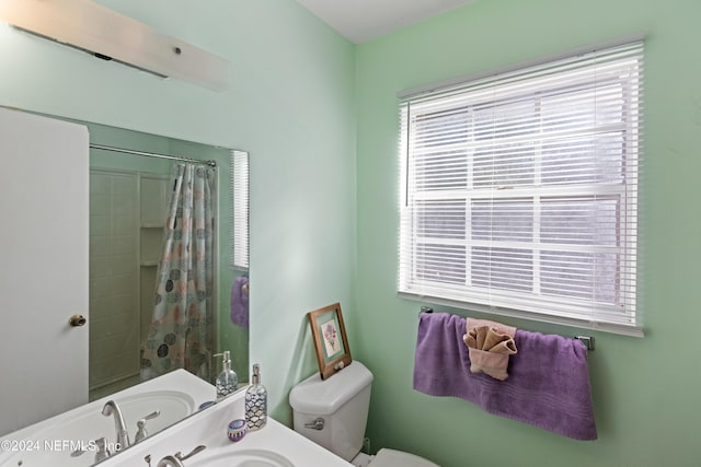 bathroom featuring toilet and shower / tub combo with curtain