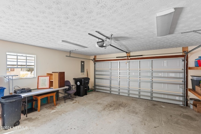 garage with electric panel and a garage door opener