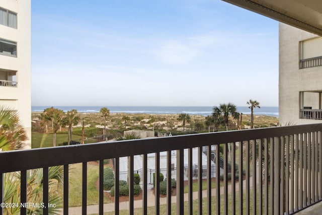 balcony featuring a water view