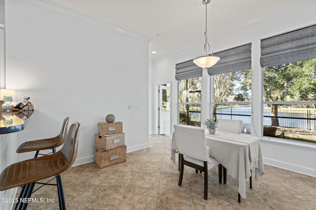 dining room with crown molding