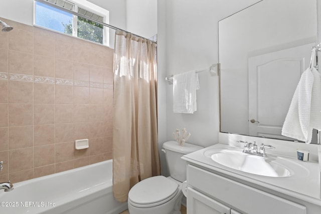 full bathroom with shower / bath combination with curtain, vanity, and toilet