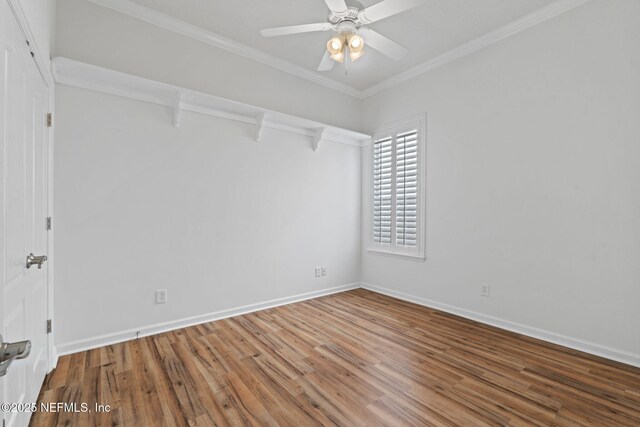 spare room featuring crown molding, hardwood / wood-style floors, and ceiling fan