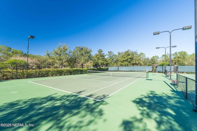 view of sport court featuring basketball hoop