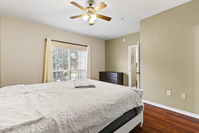 bedroom featuring ceiling fan and dark hardwood / wood-style floors