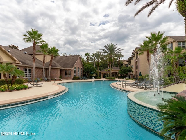 view of pool with pool water feature