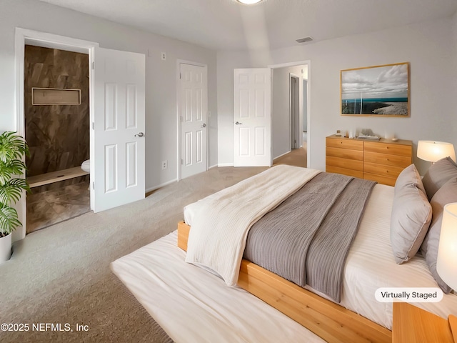 carpeted bedroom featuring connected bathroom