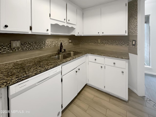 kitchen with white cabinetry, sink, and dishwasher