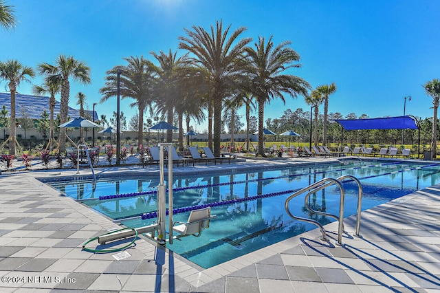 pool with a patio area