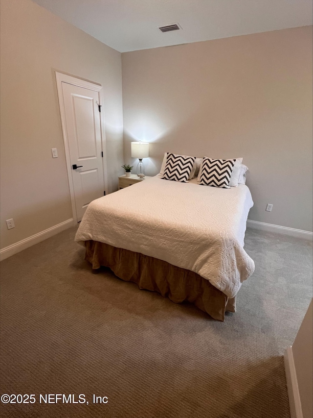 carpeted bedroom with baseboards and visible vents